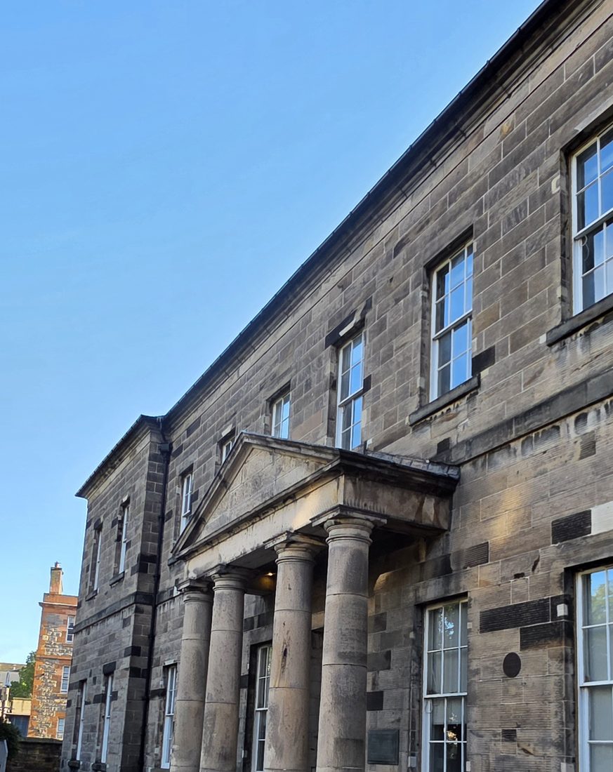 The old Edinburgh medical school, a stone building with a columned portico, where Arthur Conan Doyle studied medicine